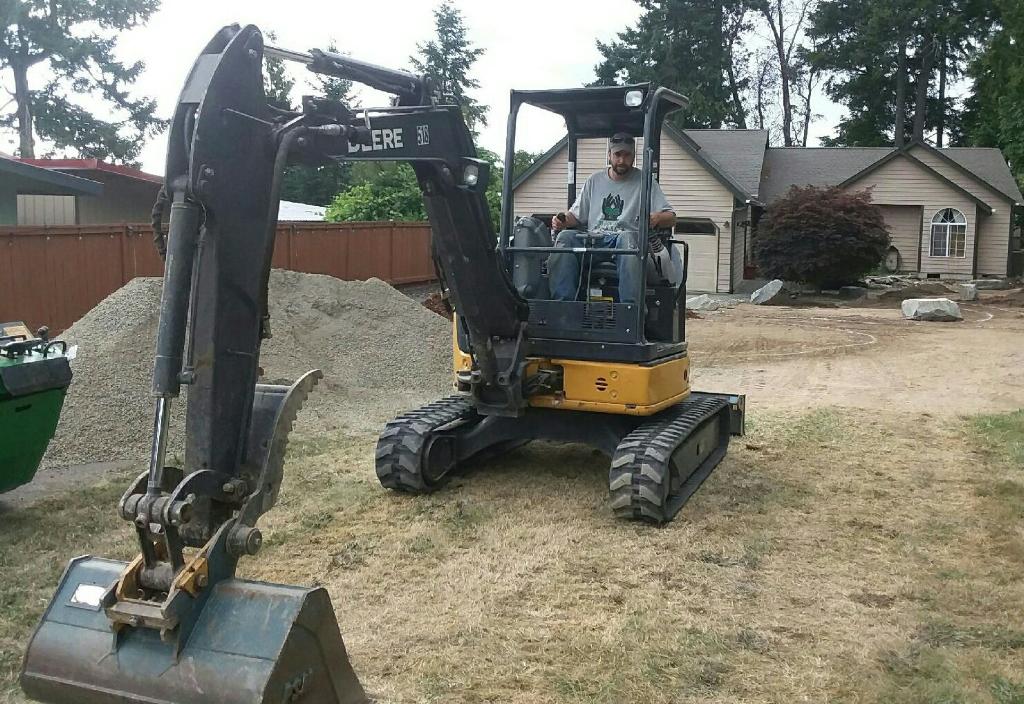 landscape professional digging up lawn